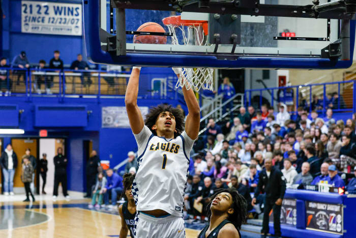 Oak Cliff Faith Family's Doryan Onwuchekwa dunks against Vashon on Jan. 20.